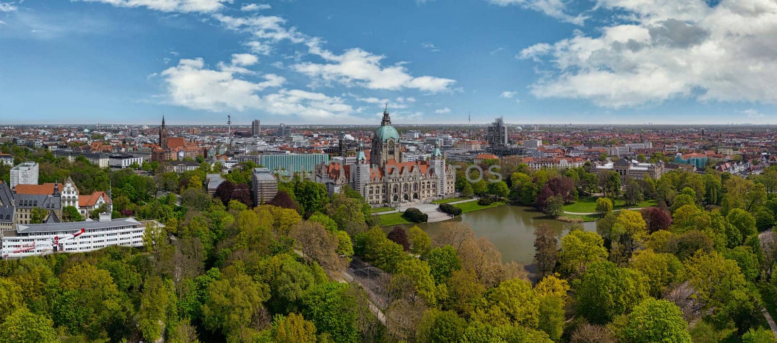 Aerial view of historic new town hall of Hanover and city centre in the background, Germany