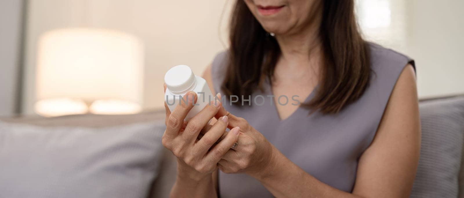 Medicine and healthcare of senior woman taking daily pill for illness, medication and sick elderly with medical drugs, vitamin or supplements in his hand.
