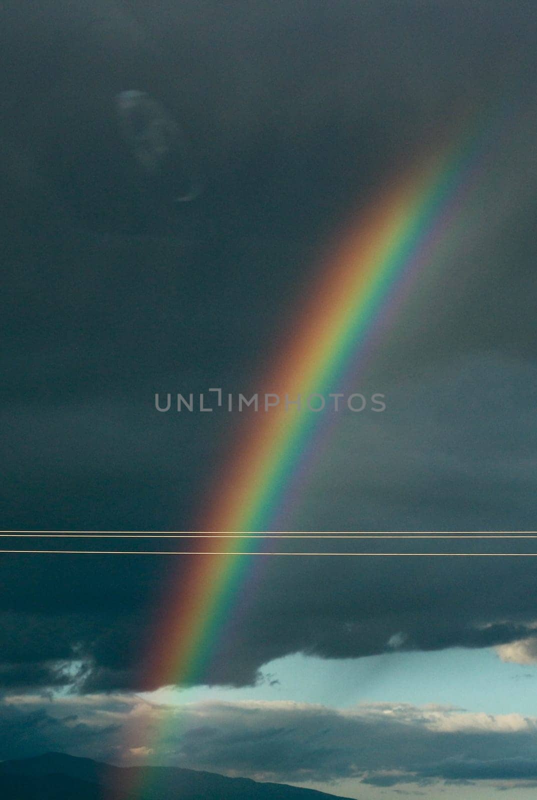 Capturing Nature's Palette: Rainbow Amidst Cloudy Skies by DakotaBOldeman