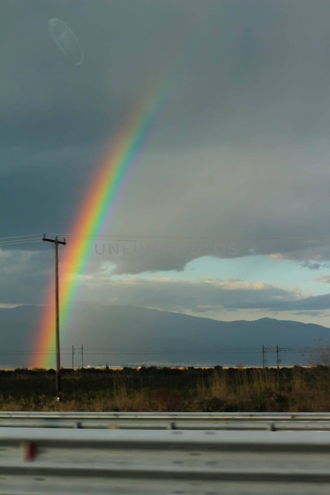Capturing Nature's Palette: Rainbow Amidst Cloudy Skies by DakotaBOldeman