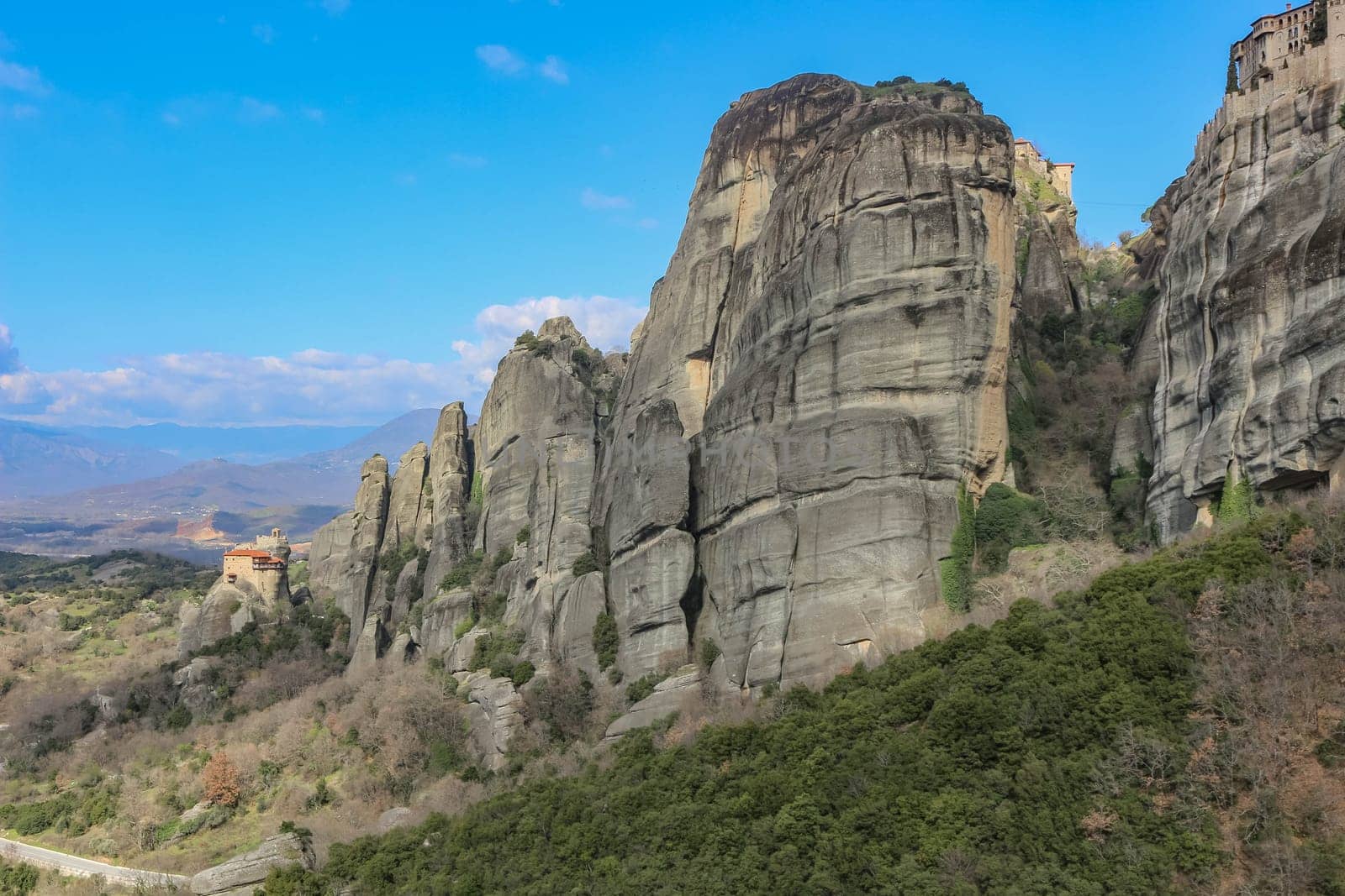 Discover serenity amidst the grandeur of Meteora's towering cliffs, where the smallest of churches offers a tranquil retreat amidst breathtaking natural beauty