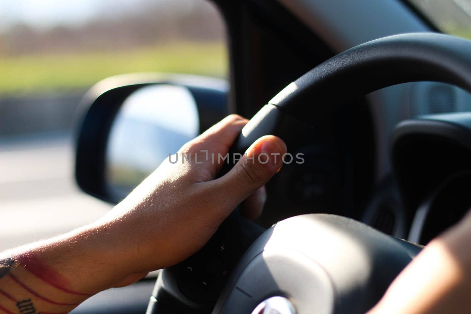 Experience the sense of control and determination as hands firmly grip the steering wheel, guiding the journey forward with precision and confidence