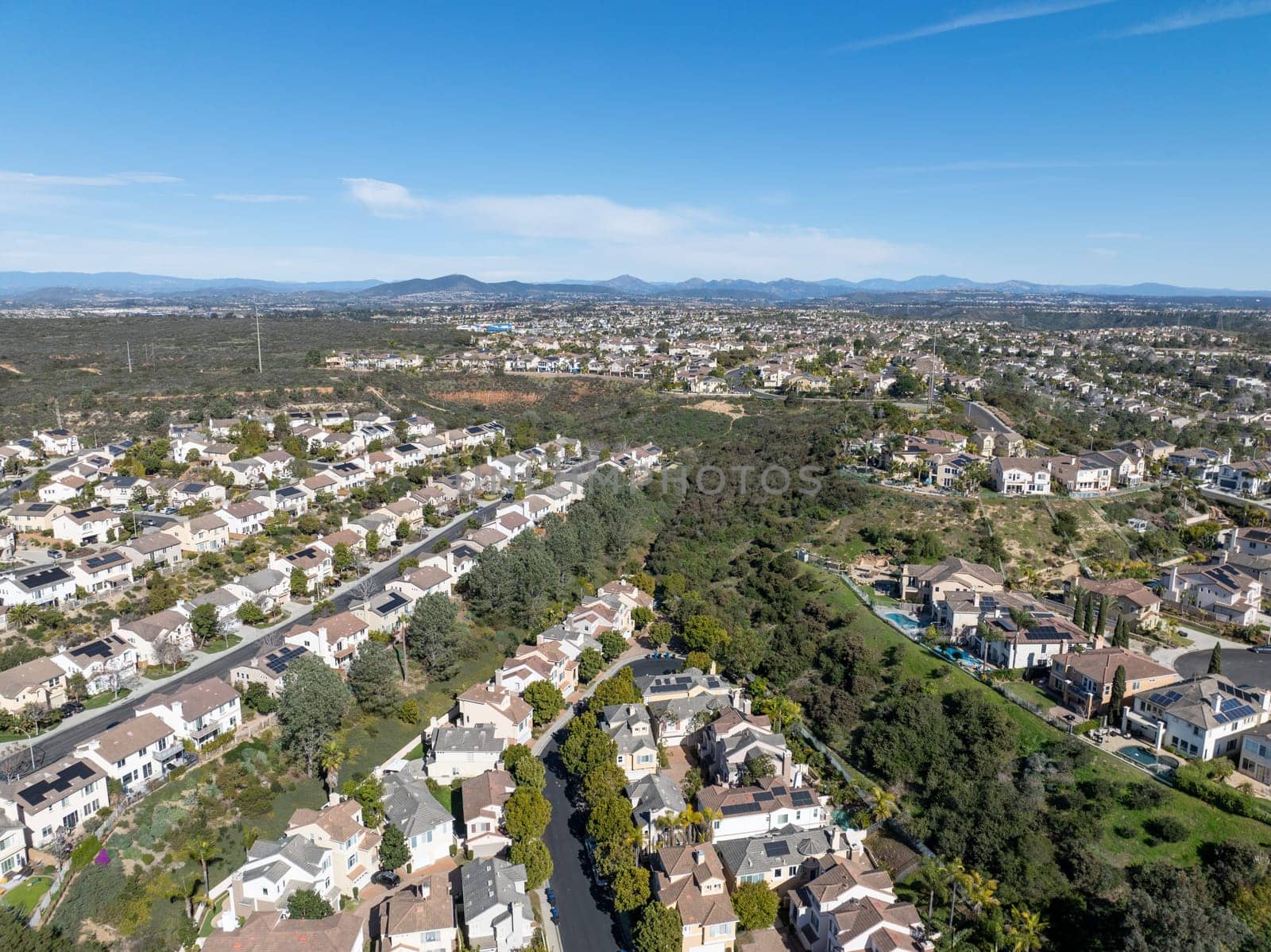 Aerial view of middle class subdivision neighborhood with residential condos and houses in San Diego, California, USA.
