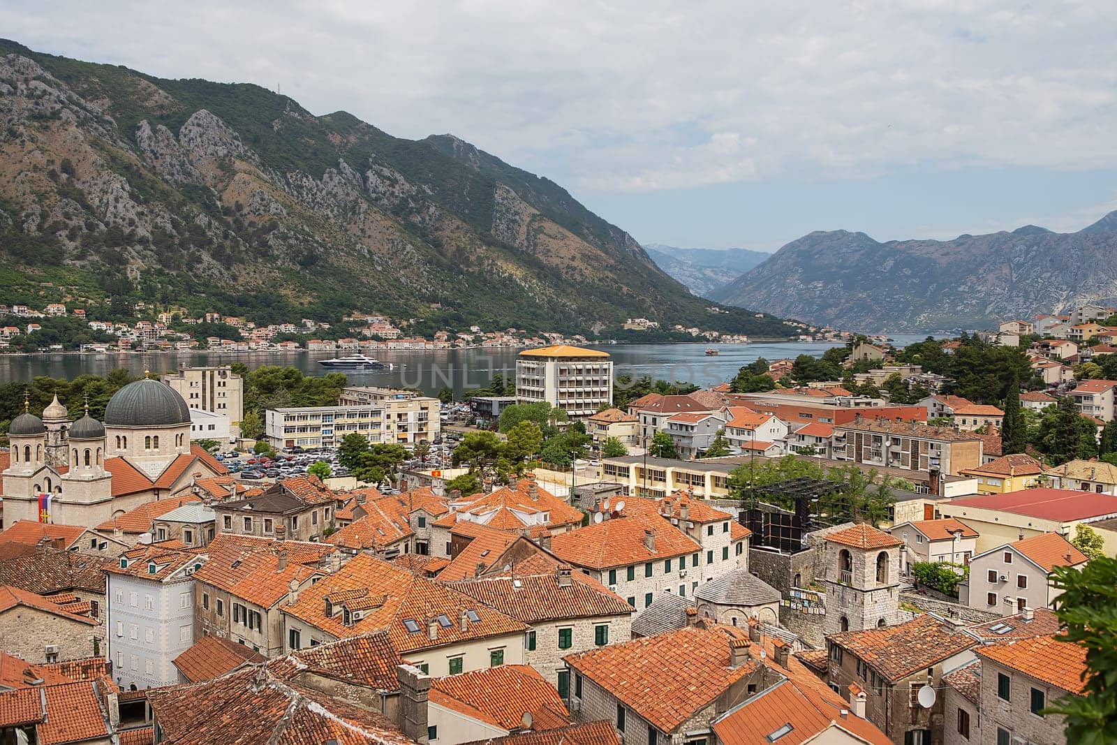 Beautiful top view of the old town of Kotor, Montenegro. Orange tiled roofs of houses from above