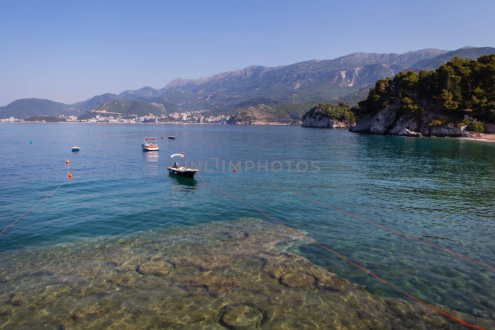 Famous architectural monument of the island-resort of St. Stephen St. Stephen in the Adriatic Sea, Montenegro. The concept of vacation at sea, boat in the sea