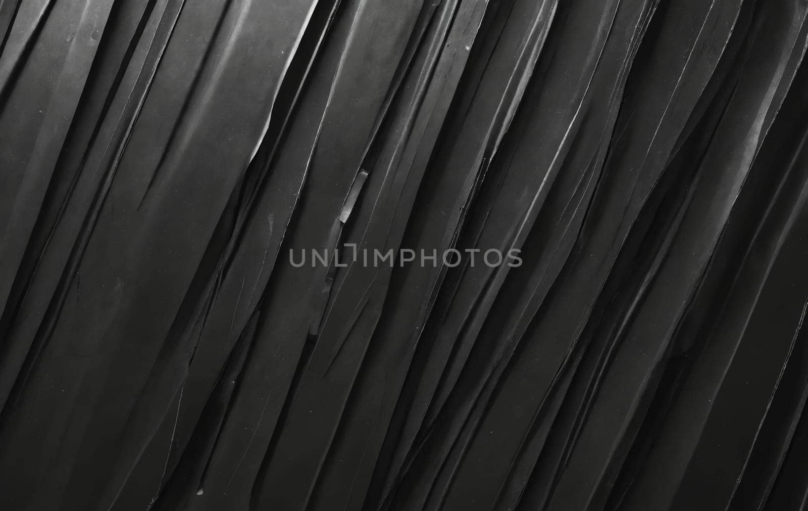 A detailed image of a black feather texture against a black background, resembling tints and shades commonly found in automotive tires and flooring materials made of synthetic rubber