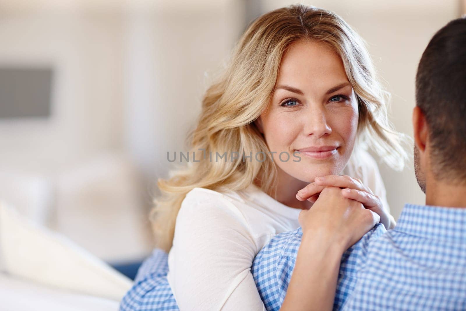Couple, sofa and closeup with smile in home for relaxation, marriage or love and happiness. Man, woman and portrait with care and cheer in house, romance in living room and relationship with joy.
