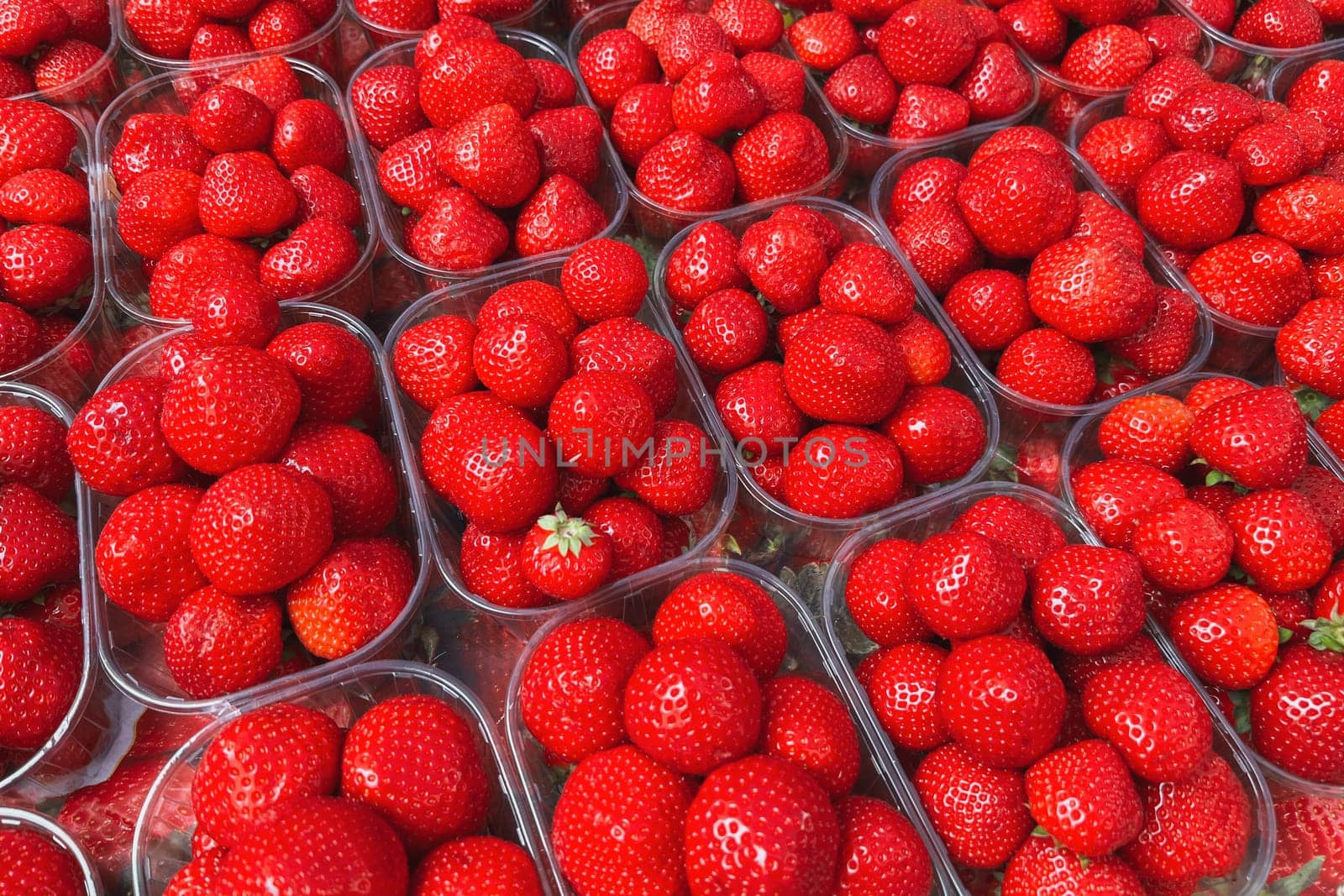 Boxes of strawberries in a French market by Godi