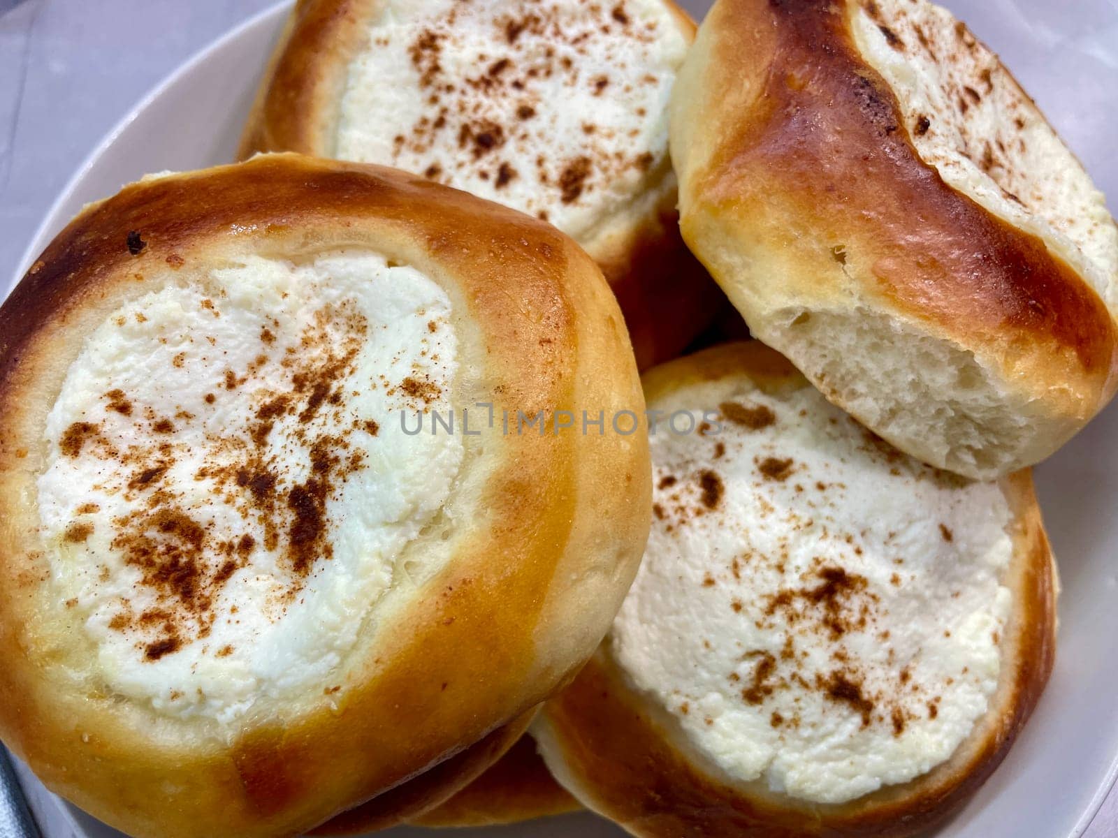 Pies with cheese are baked and ruddy on a gray plate. High quality photo