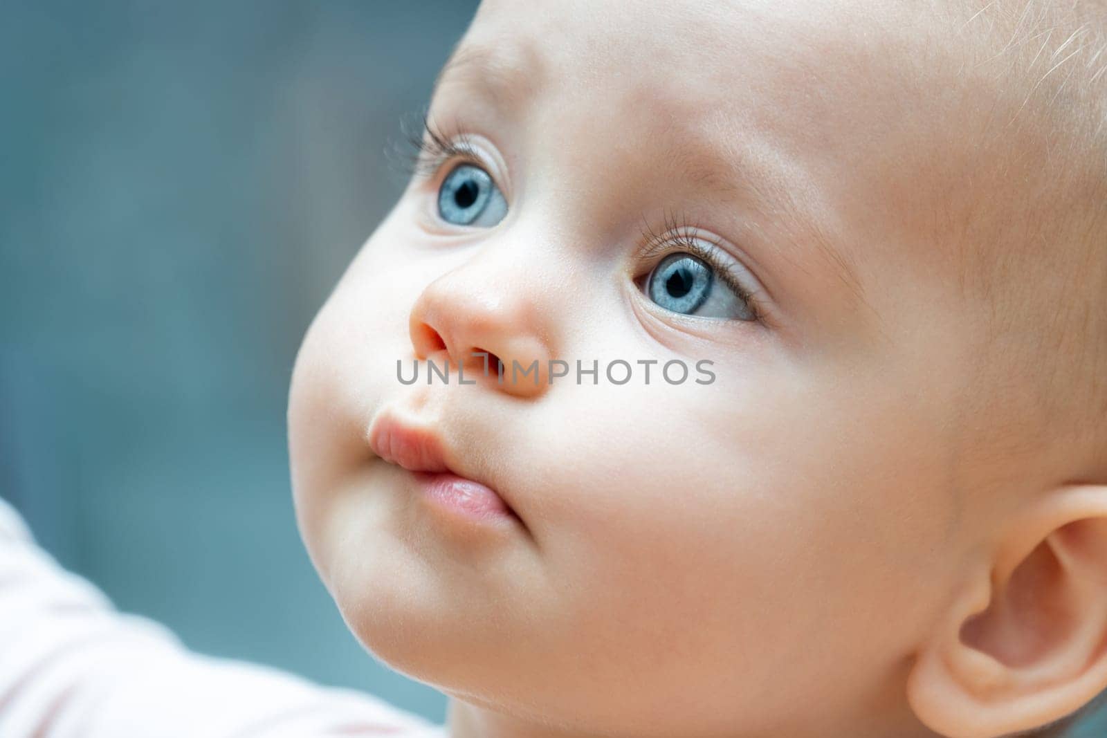 Portrait of beautiful baby girl with blue eyes by Mariakray