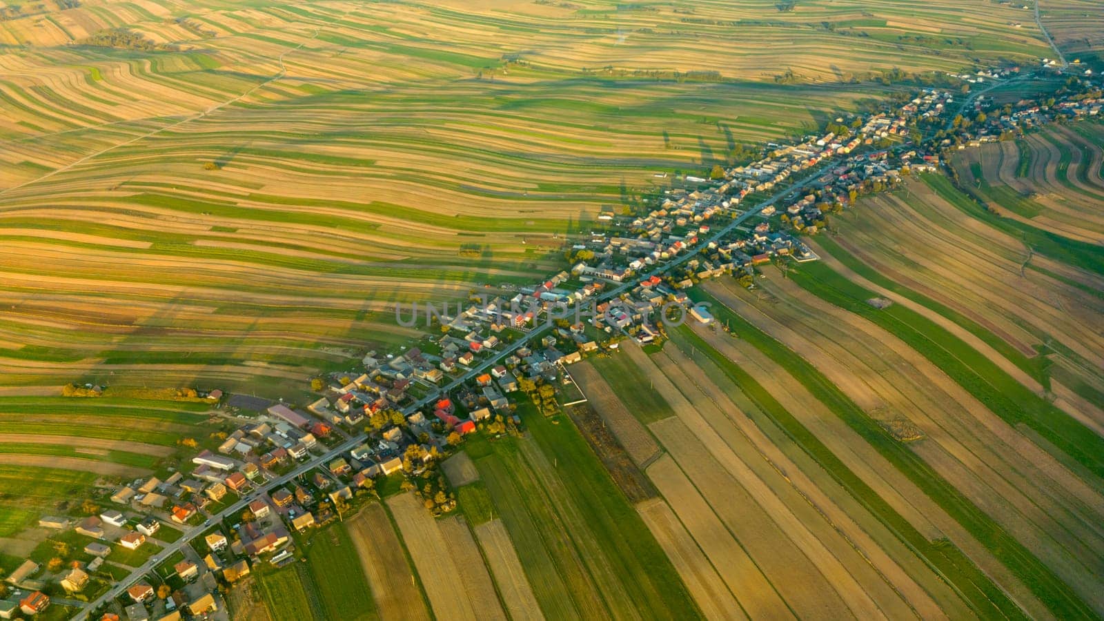 Aerial drone view of Suloszowa village along road in Krakow County. Beautiful countryside landscape of Poland