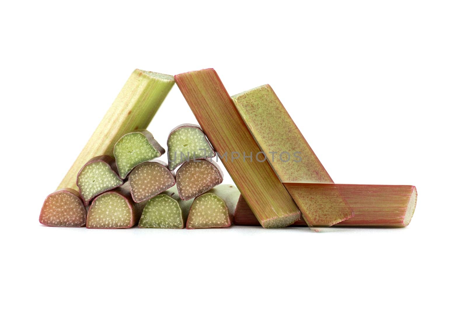 Variety of rhubarb stalks of varying colors from pale green to deep red isolated on white background, health benefits of eating rhubarb
