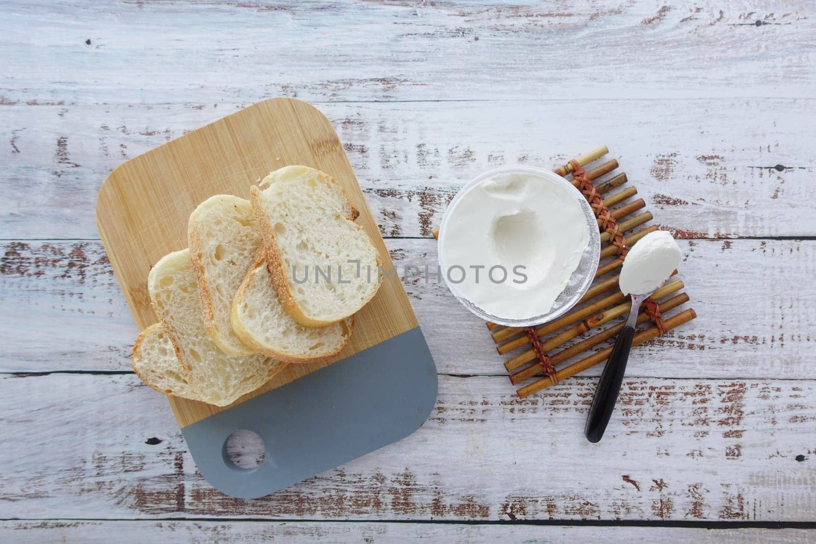 low fact cheese cream and bread on table by towfiq007