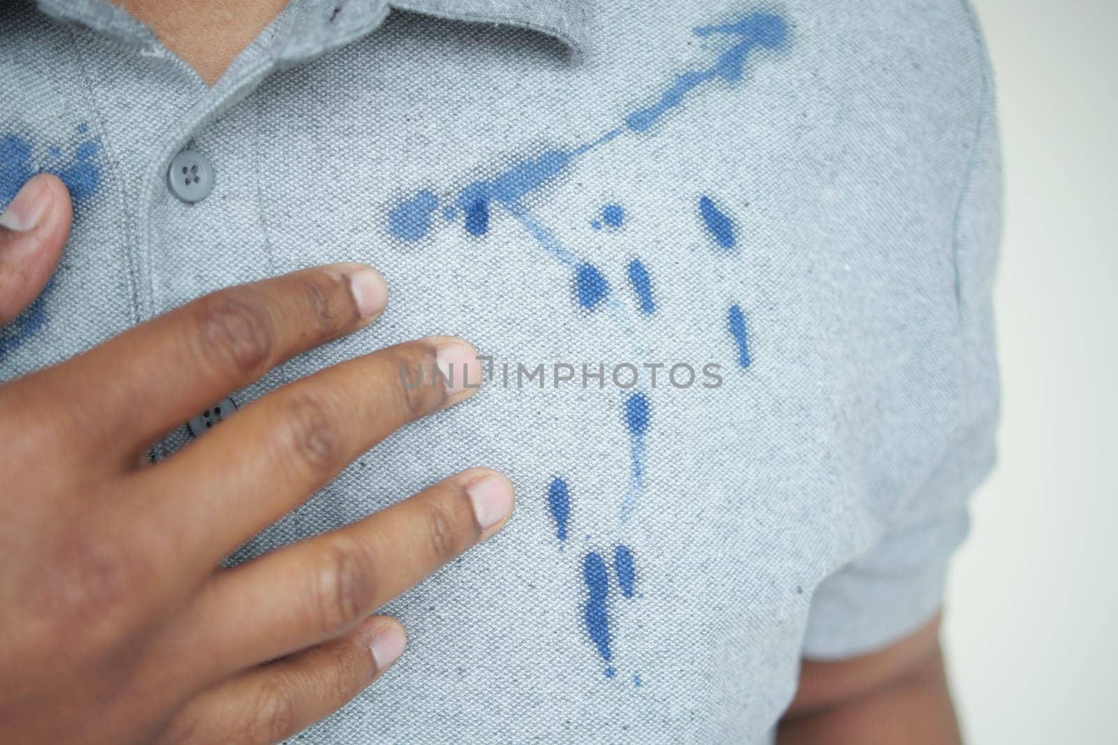 shirt with blue ink stain