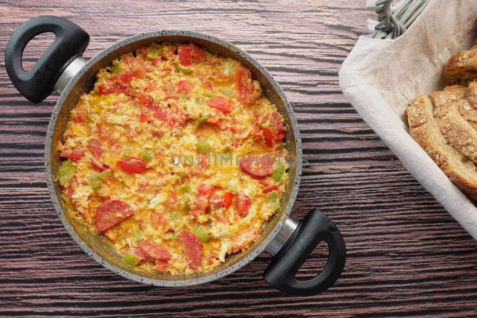 Turkish Menemen omelet in a frying pan.