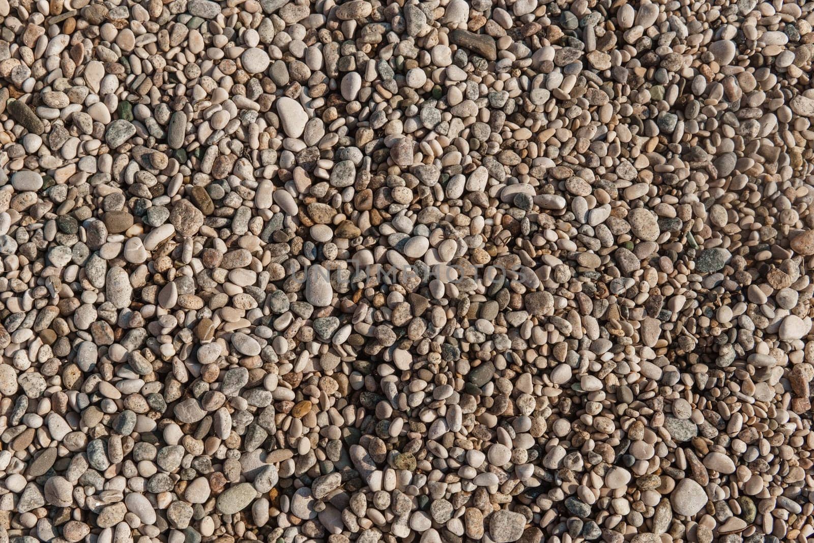 Pebbles on the seashore, close-up. Natural background