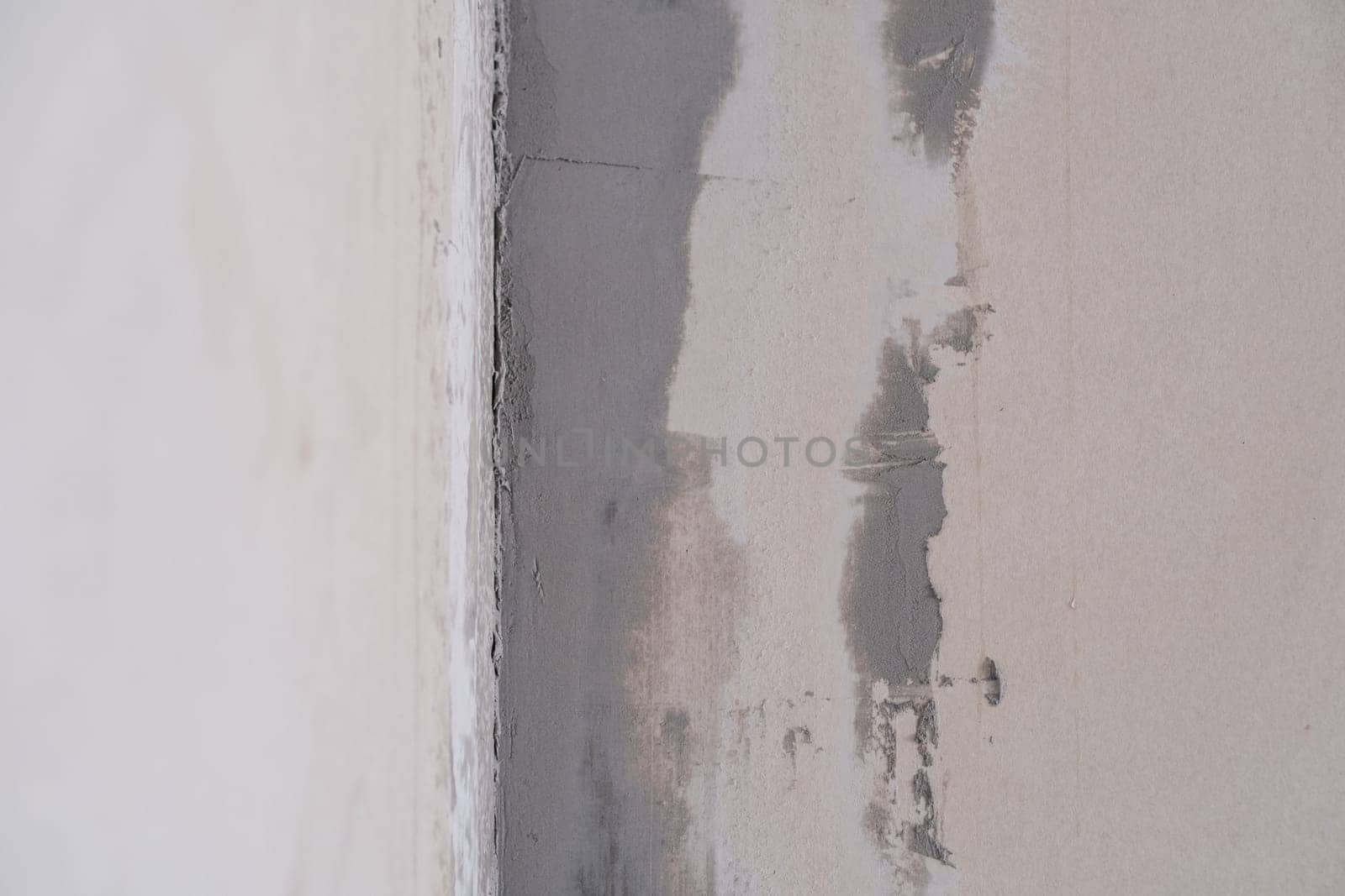 Applying decorative putty. White abstract texture of surface covered with putty by AnatoliiFoto