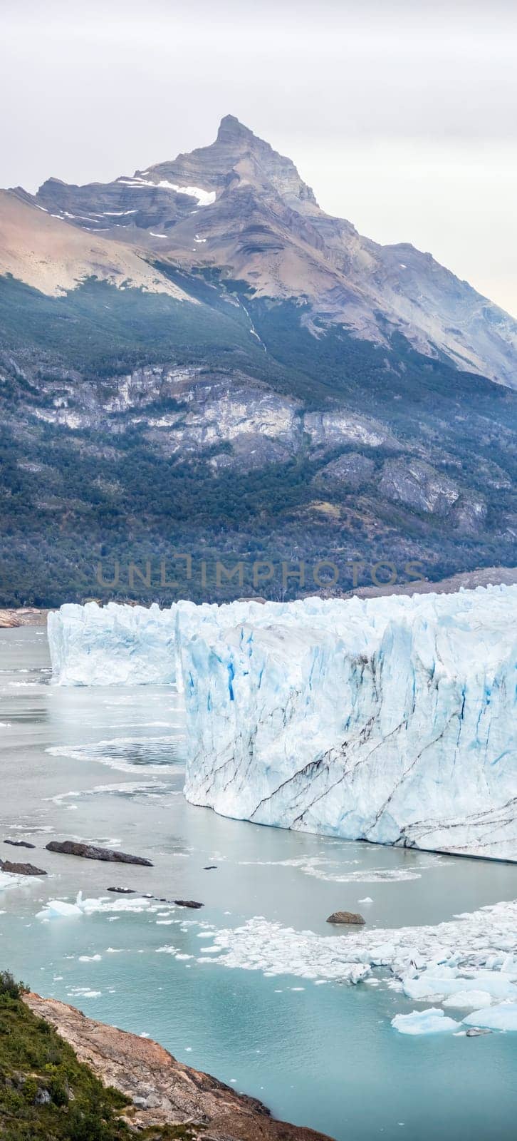 Majestic Glacier Front with Mountain Peaks and Ice by FerradalFCG