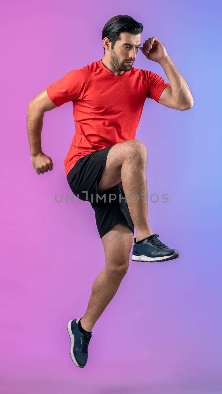 Full body length gaiety shot athletic and sporty young man fitness running cardio exercise posture on isolated background. Healthy active and body care lifestyle.