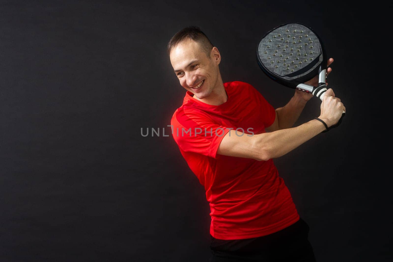 Paddle tennis: Man, Player with hand and Paddel racket and ball . High quality photo