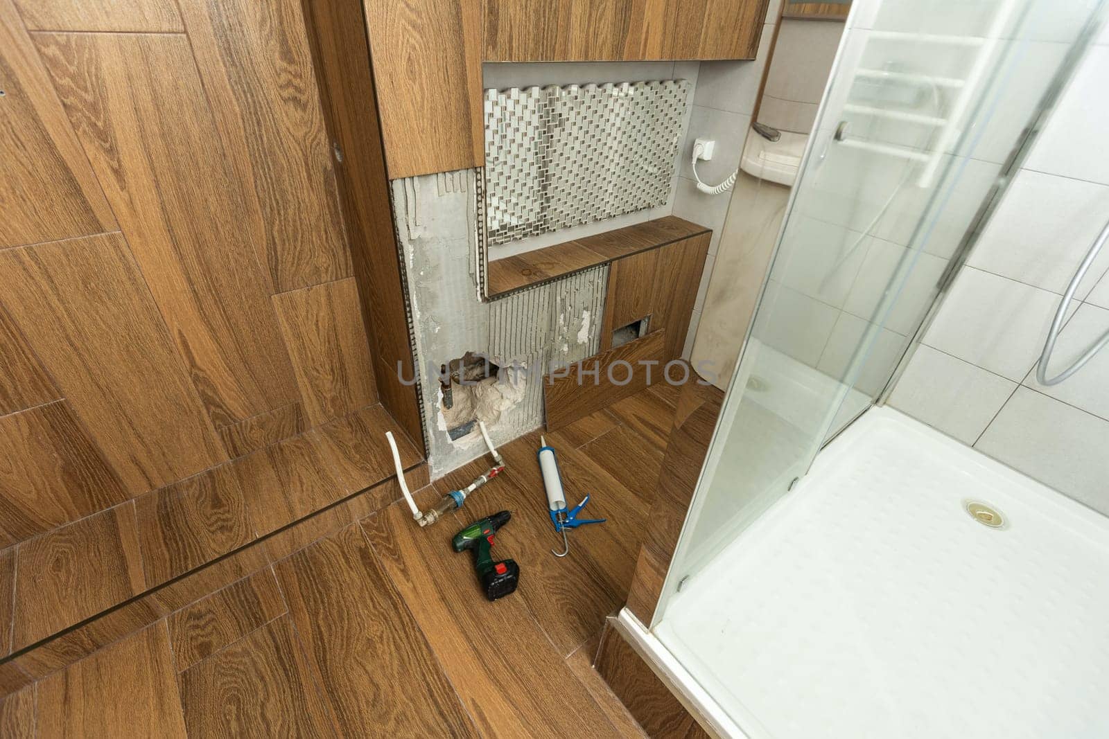 Water damaged wall in an old house. Water damage building interior. wall house broken. Ceiling concrete crack and exposed the rusty steel bar frame. High quality photo
