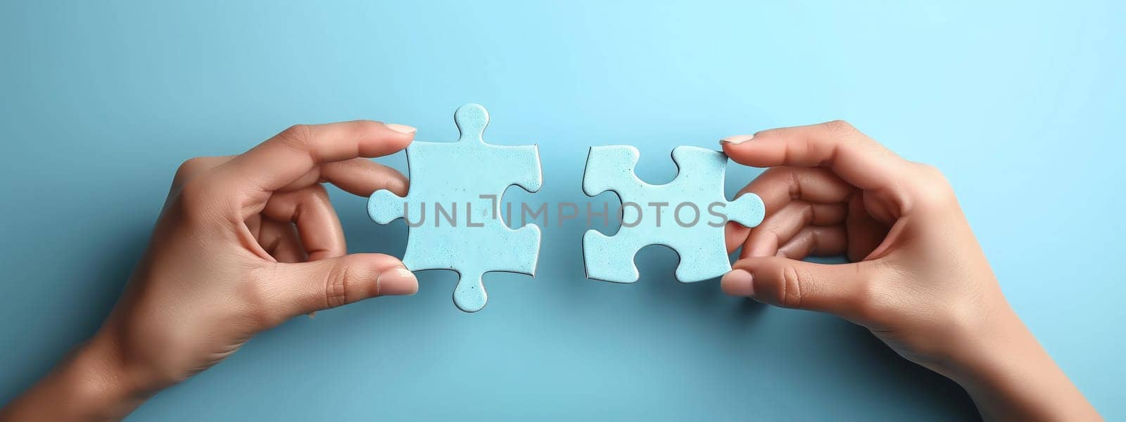 Gesture of holding two puzzle pieces together on electric blue background by richwolf