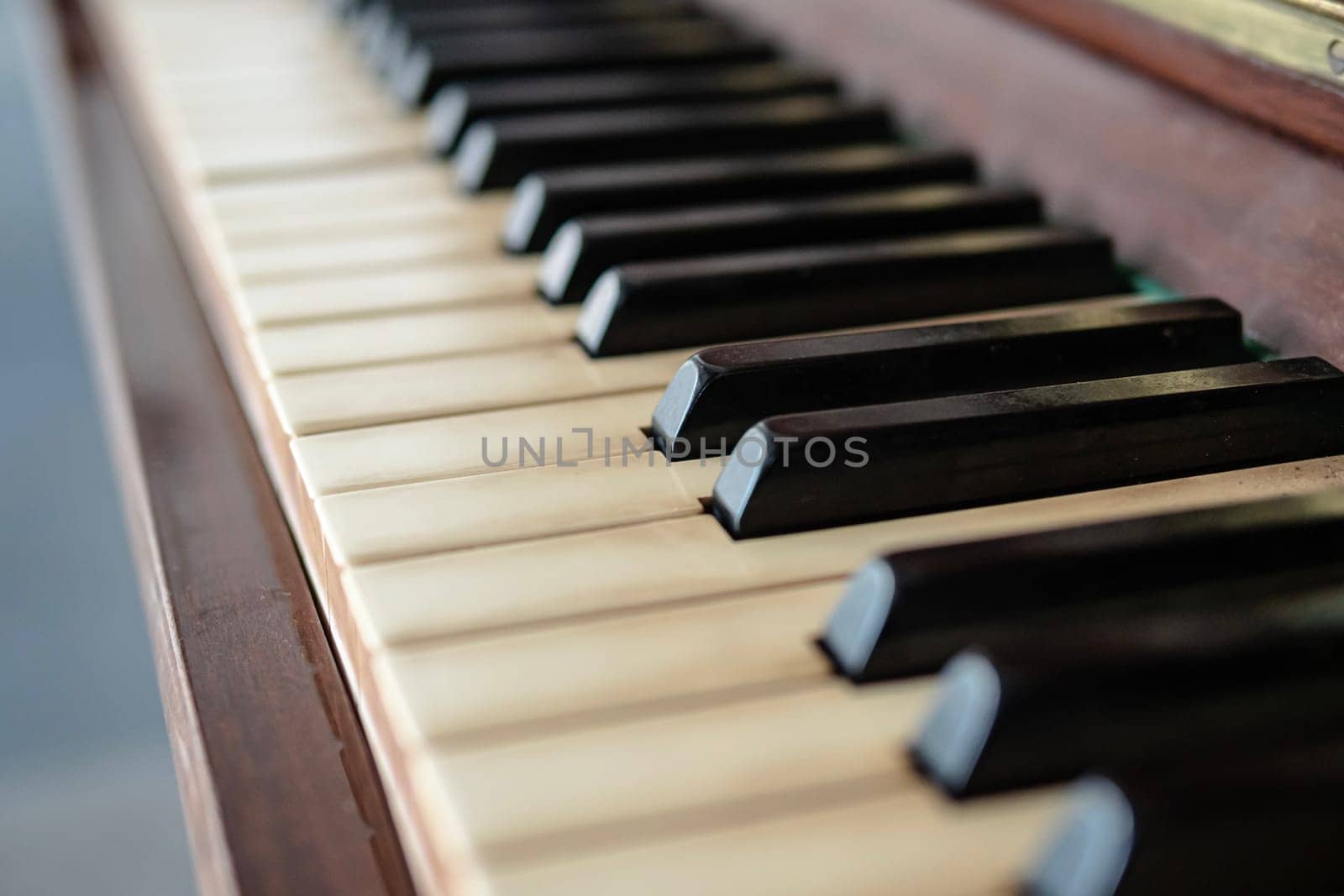 Closeup of an old piano keyboard . detail from old vintage piano keyboard