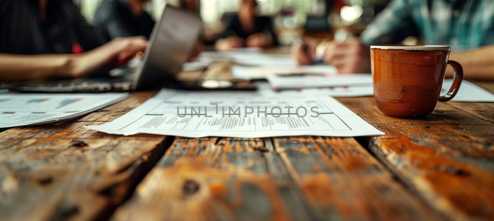 A group gathers around a hardwood table, papers spread out and coffee cups steaming. The urban design event is filled with creativity and inspiration