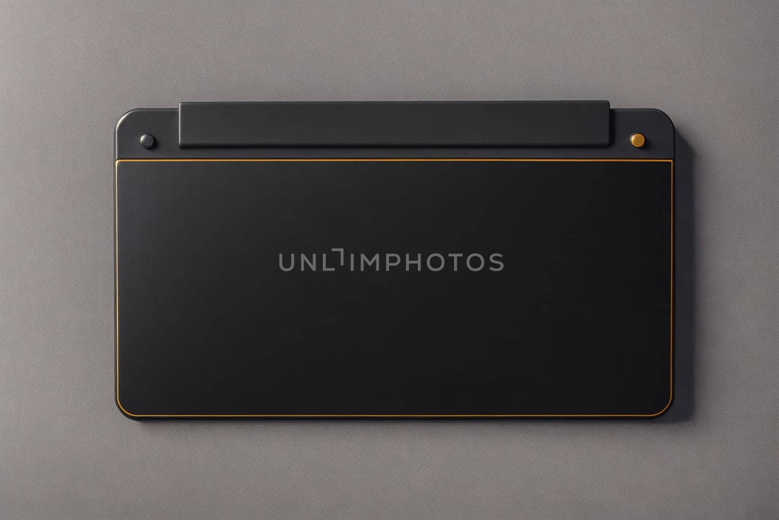 The image is a grey rectangular box with a small handle on the top and a small opening on the front.