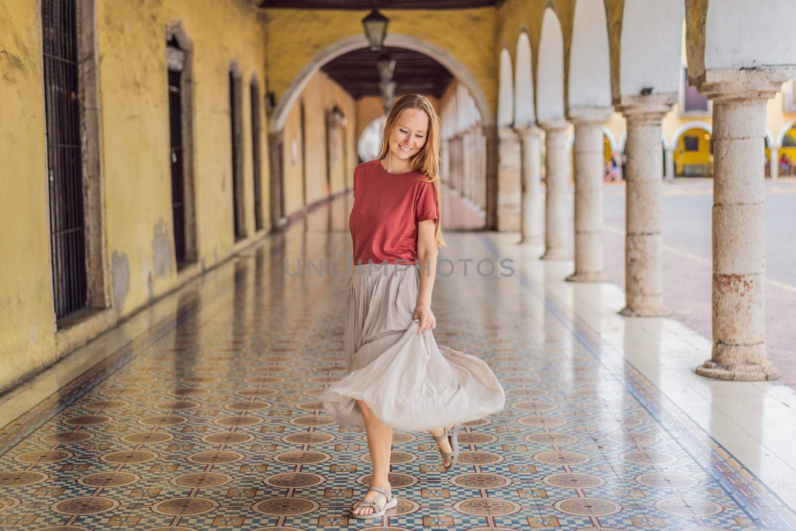 Woman tourist explores the vibrant streets of Valladolid, Mexico, immersing herself in the rich culture and colorful architecture of this charming colonial town.