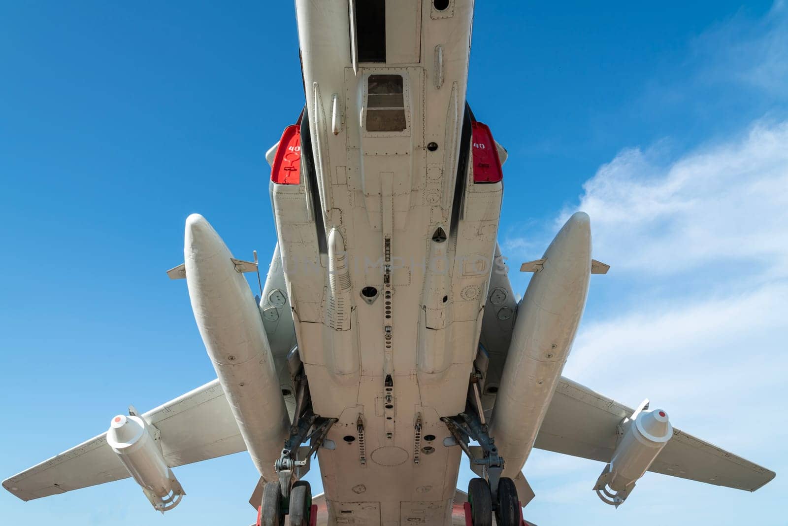 combat aircraft fighter bomber on a blue sky background. photo