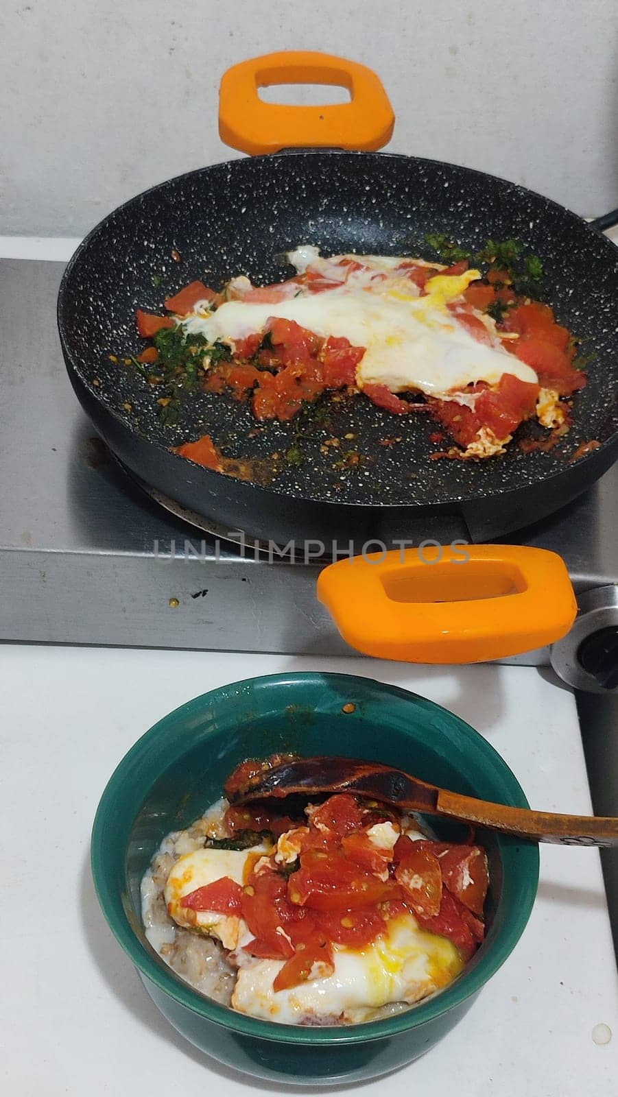 egg with tomatoes, green plate breakfast food. High quality photo