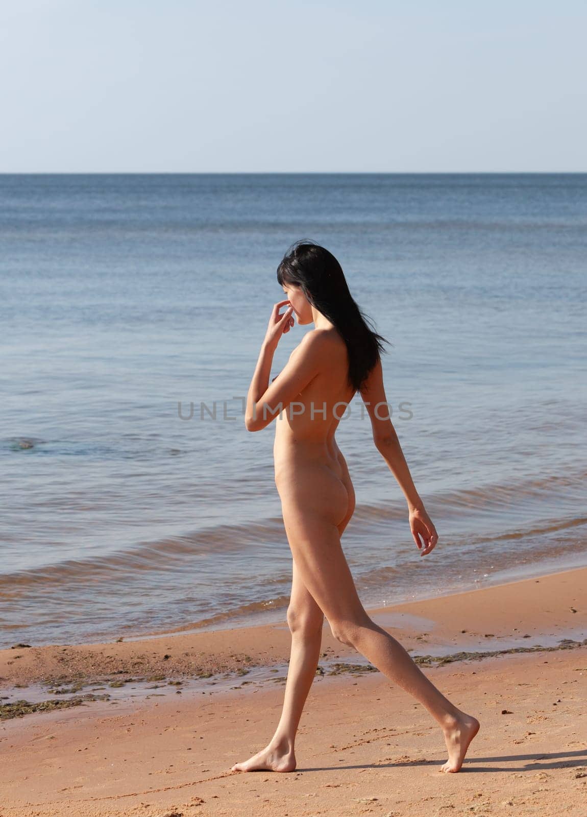Nude Woman Posing At The Seaside by palinchak
