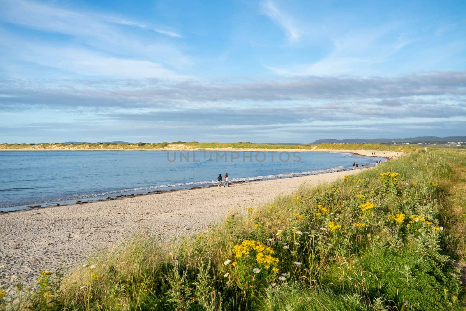 MAGHEROARTY, IRELAND - JULY 31 2022: Holiday makers enjoying the are.