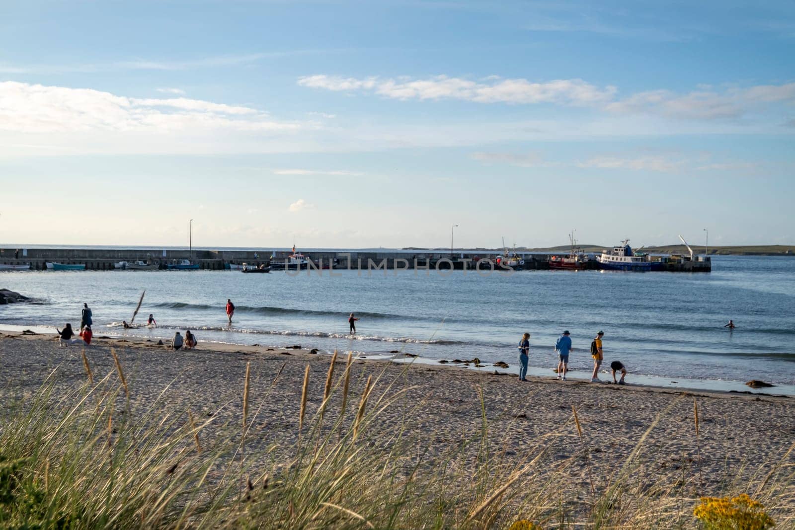 MAGHEROARTY, IRELAND - JULY 31 2022: Holiday makers enjoying the are.