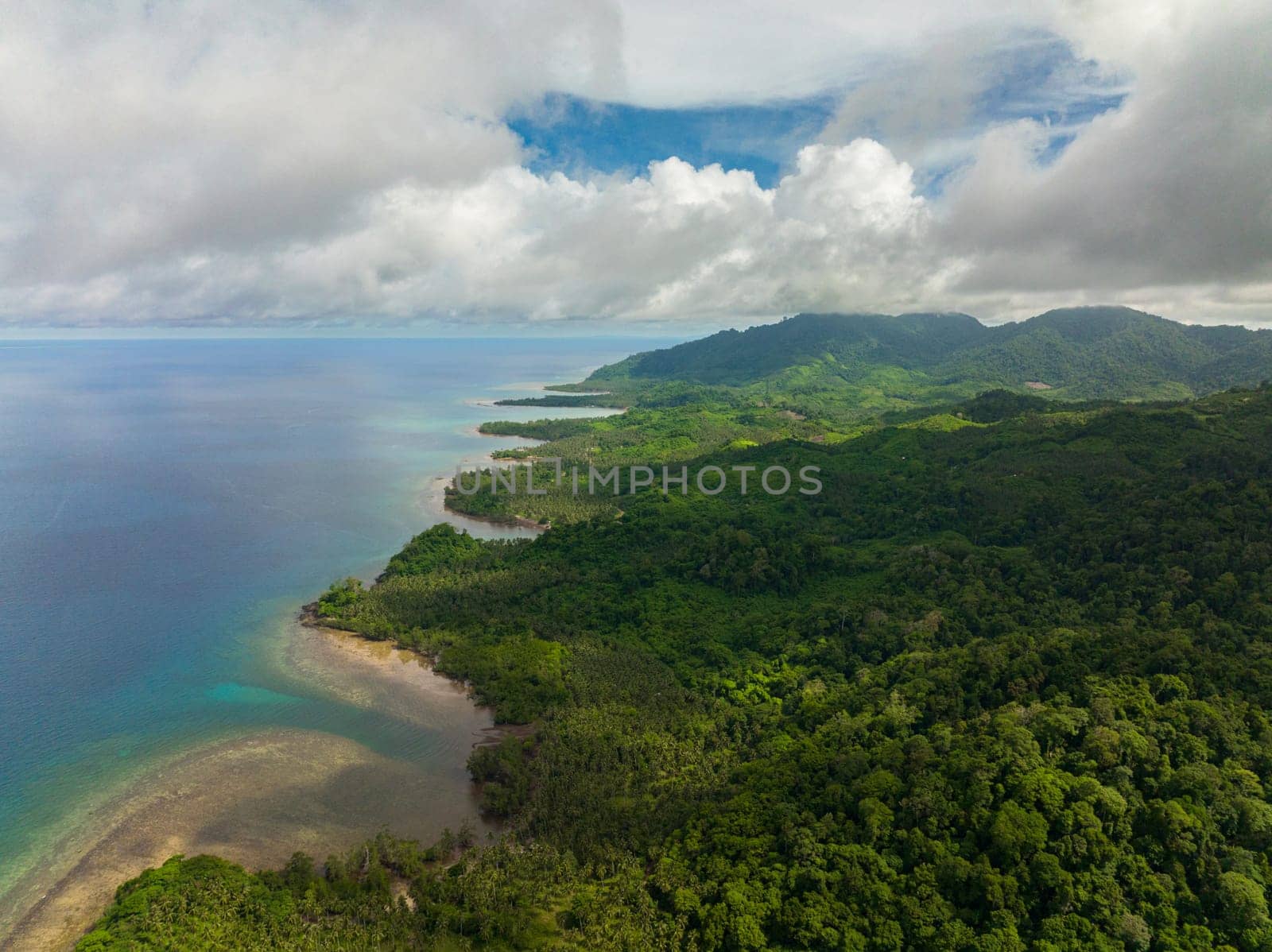 Top view of Balabac island with tropical forest and blue sea. Palawan. Philippines.