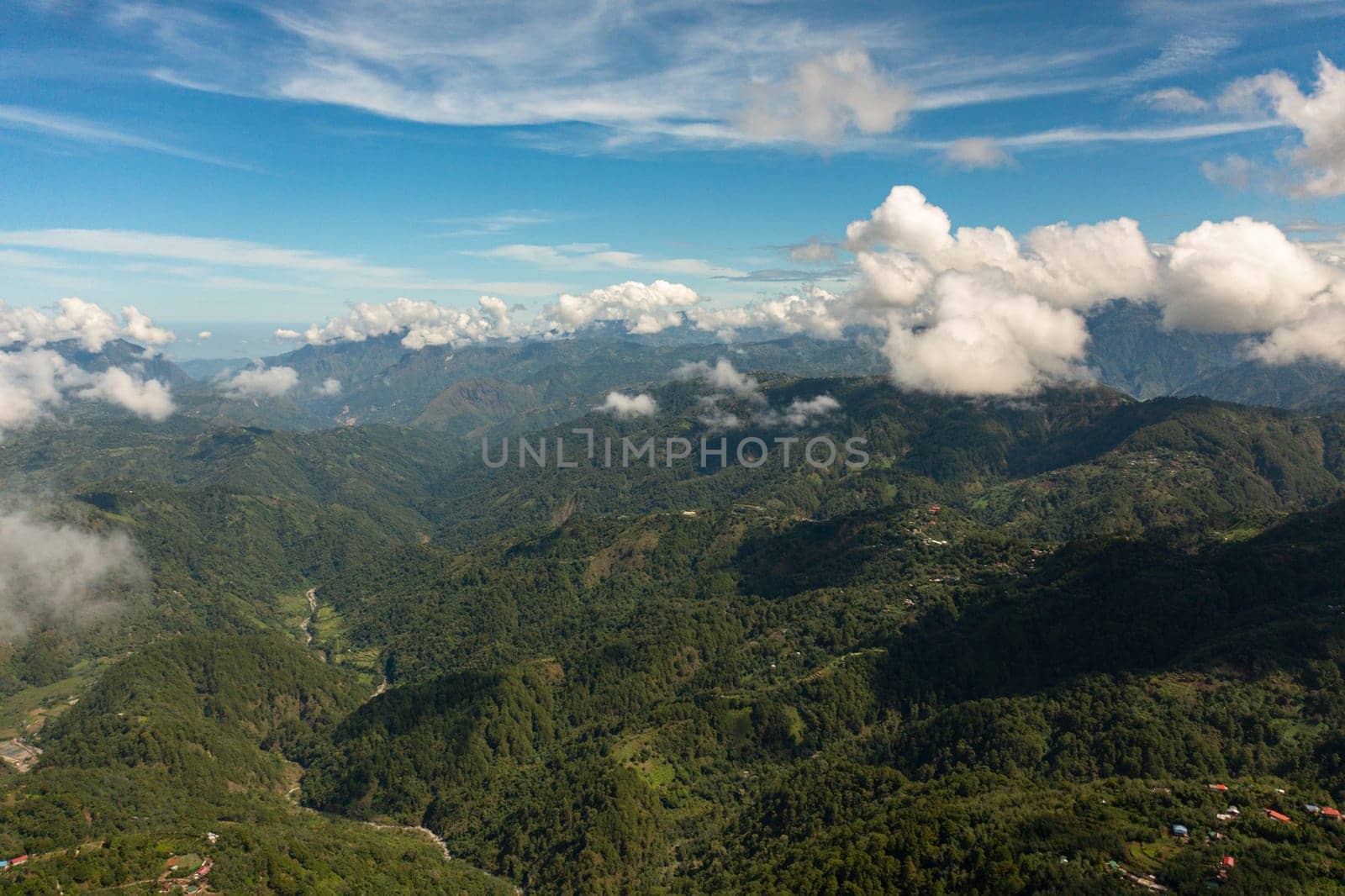 Mountain peaks covered with forest from above. Philippines.