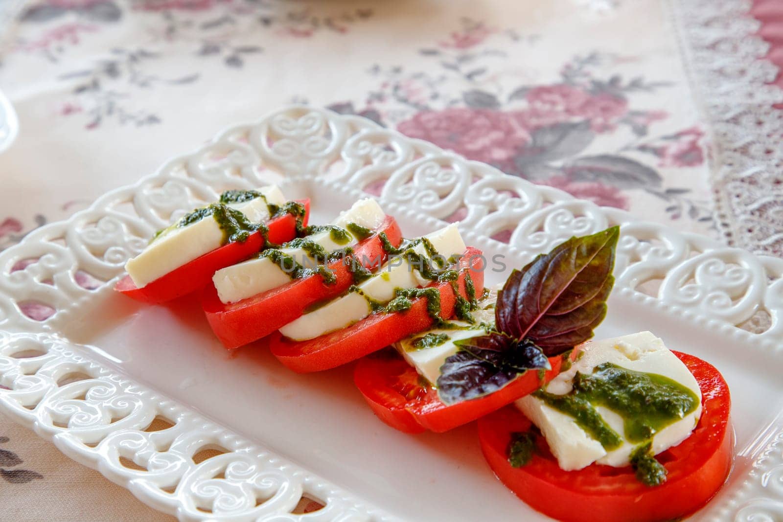 Traditional Italian Caprese salad on the plate. Close view.  by EdVal