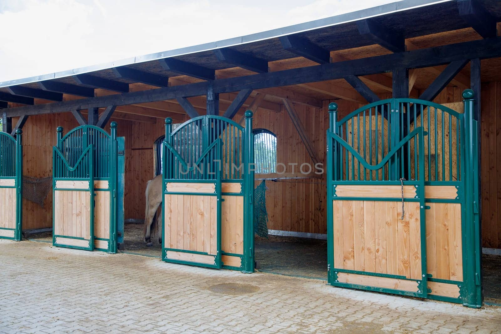 New horse stable facade in blue colors by EdVal