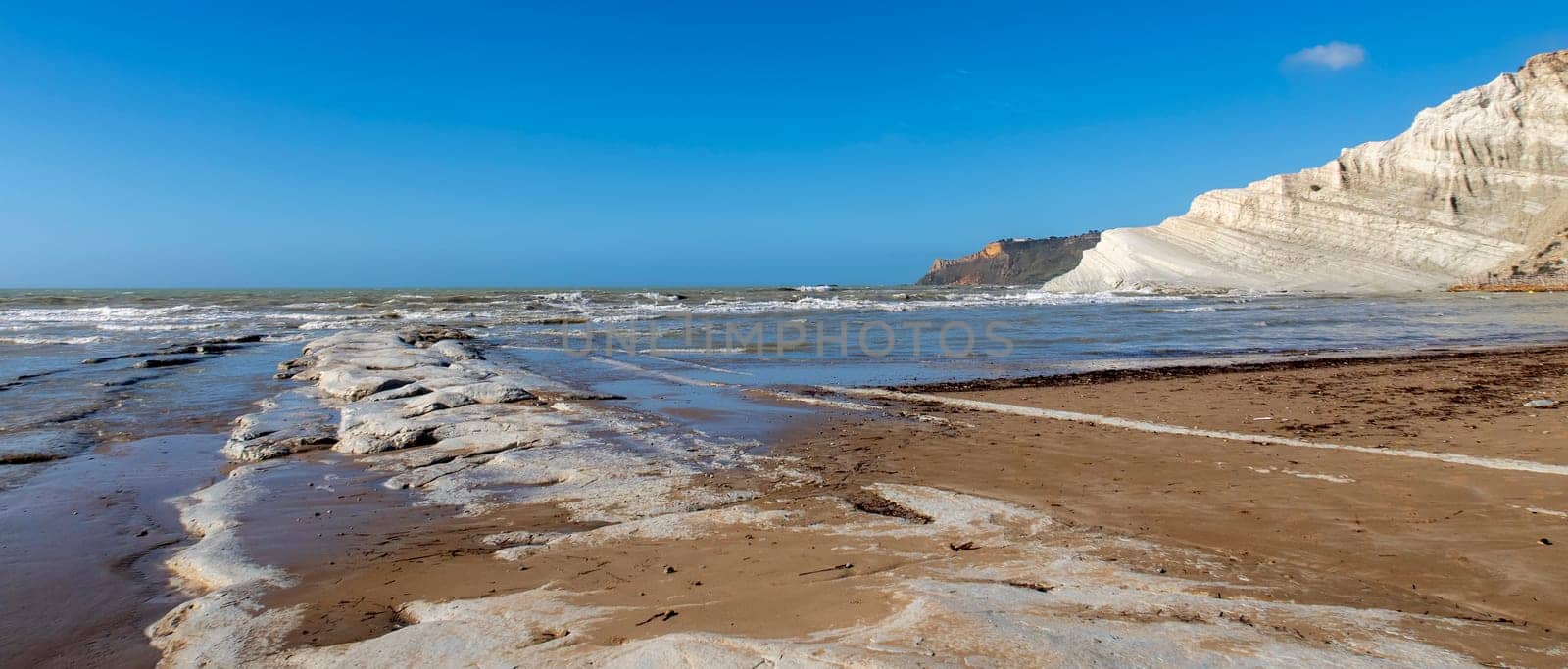 View of the limestone white cliffs with the beach at Stair of the Turks or Turkish Steps near Realmonte in Agrigento province. Sicily, Italy