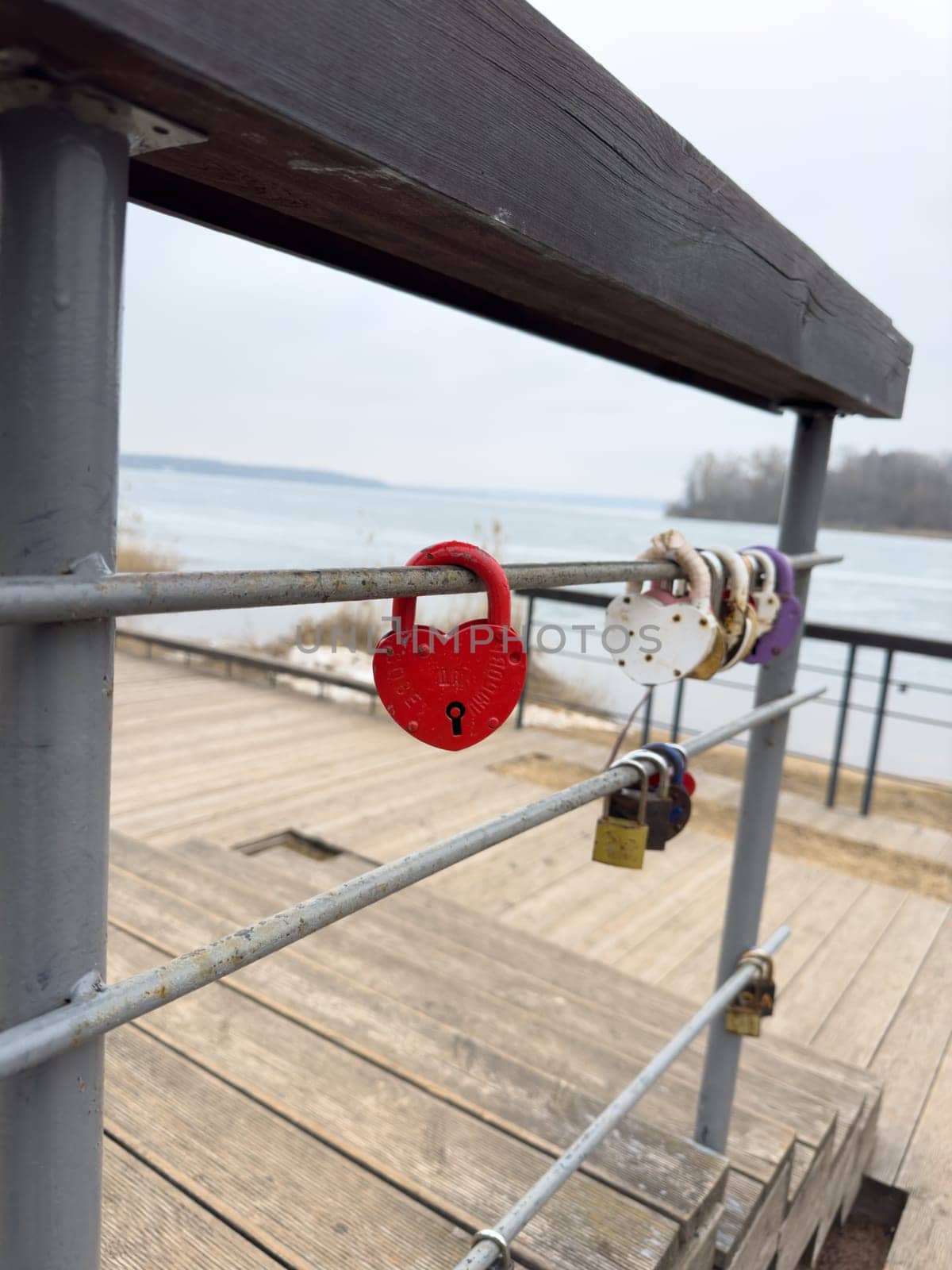 colorful locks hanging on the railings