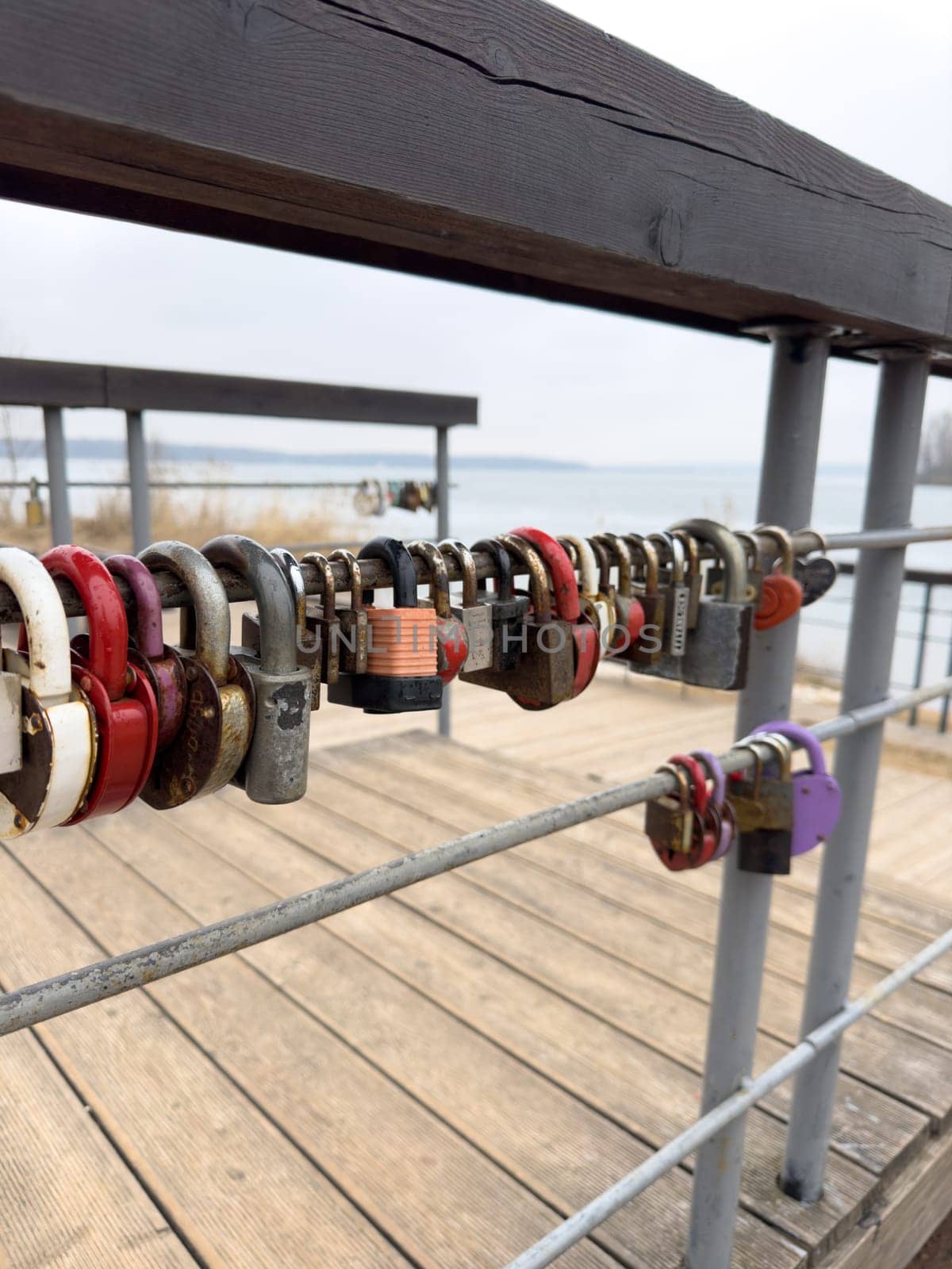 colorful locks hanging on the railings