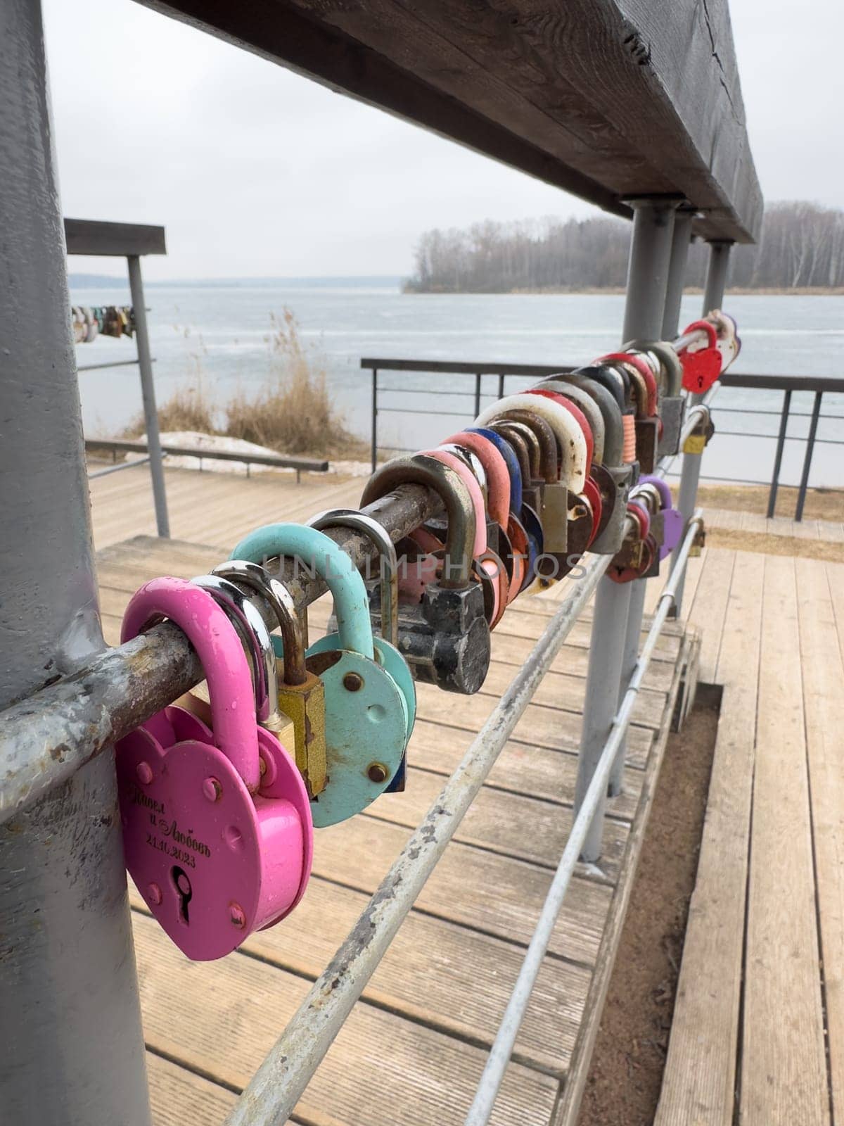 colorful locks hanging on the railings