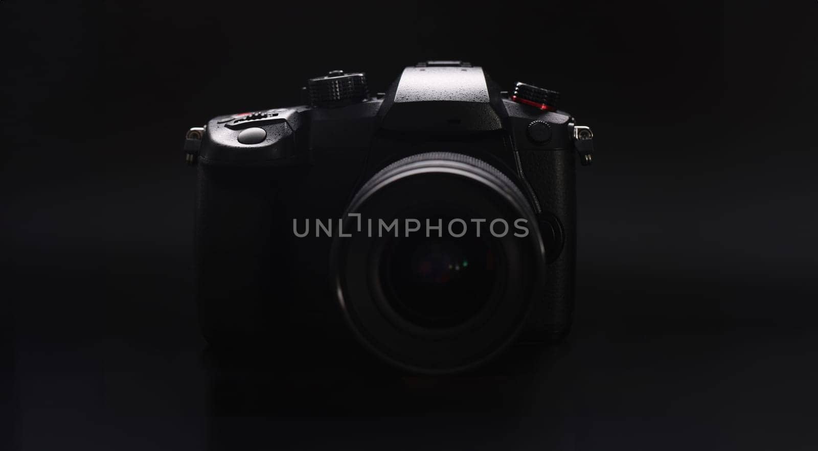 Close-up of modern camera model, good quality of pictures, brand new device for photoshot session. Technology, development, backstage, photography concept