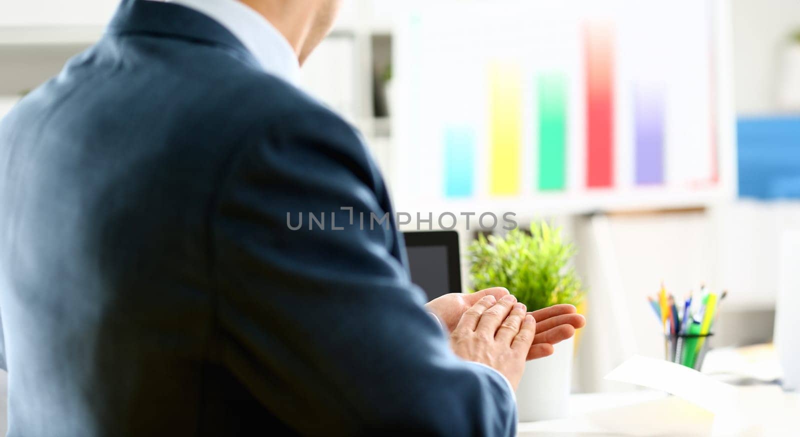 Man in suit clap his arms congrats for successful seminar in office closeup. Thank symbol great lecture job emotion worker introduce colleague negotiation happy birthday win career project idea