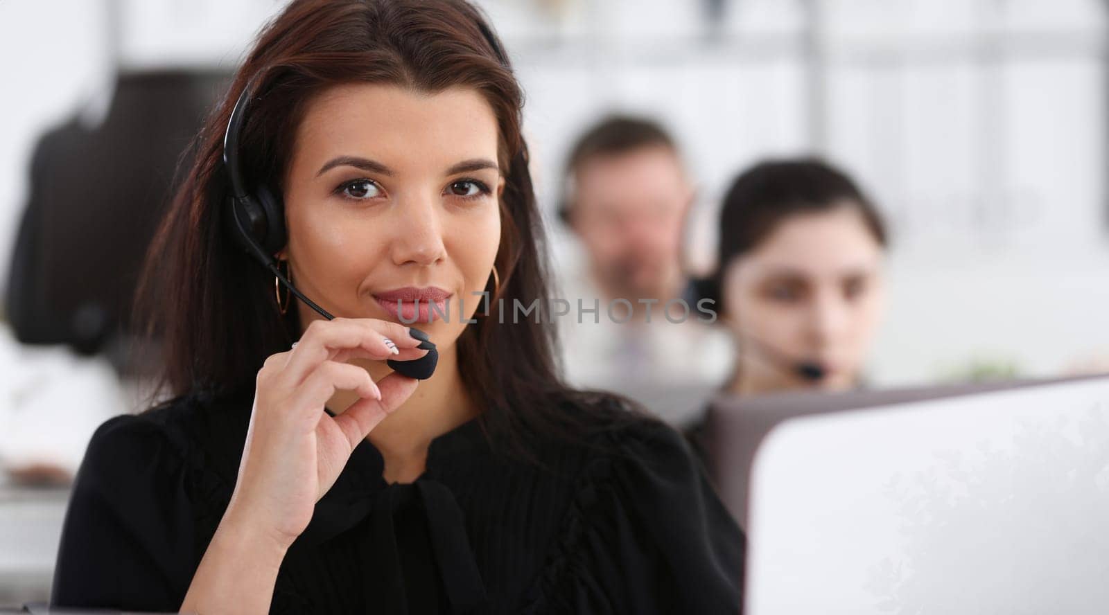 Three call centre service operators at work by kuprevich
