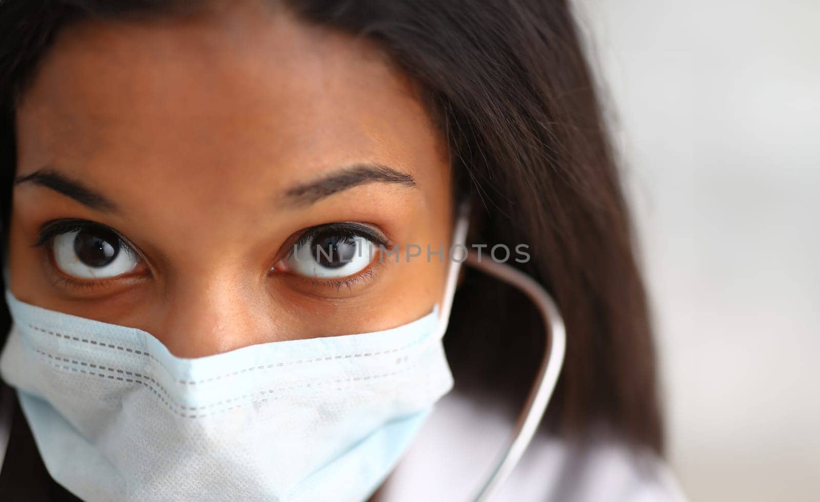 Black female doctor in a face mask by kuprevich