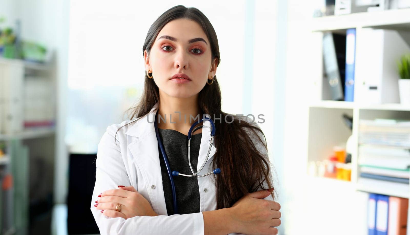 Beautiful smiling female doctor at workplace portrait. Physical and disease prevention patient aid exam visit 911 ward round prescribe remedy healthy lifestyle consultant profession concept