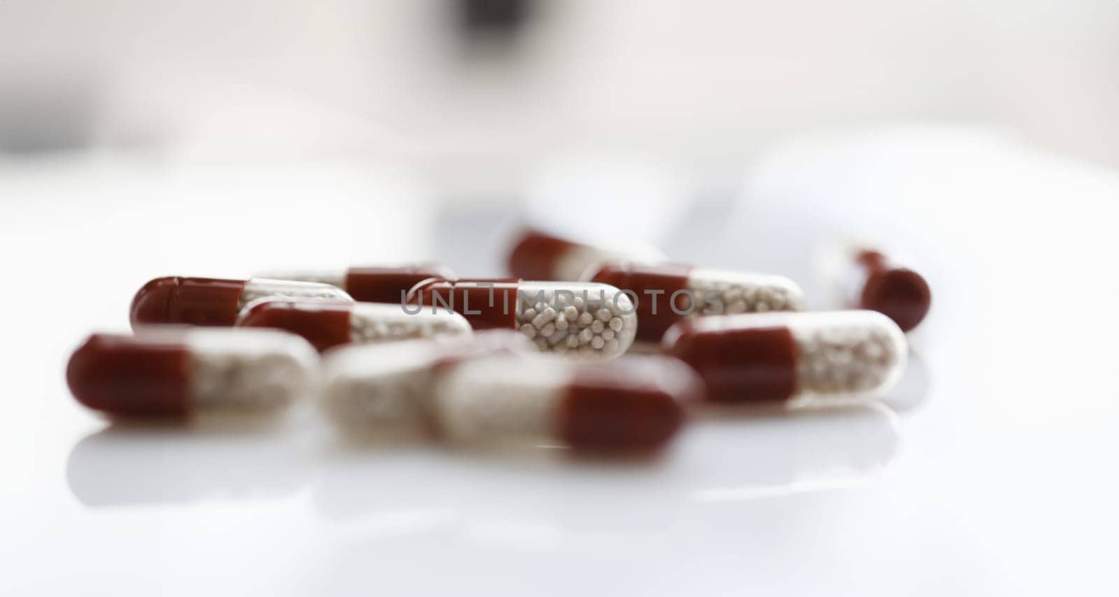 Tablets scattered on the table of the pharmaceutical laboratory pill for the prescription and treatment of various diseases chemistry