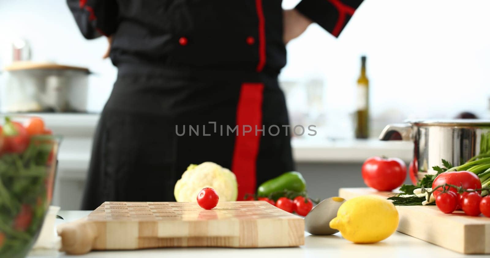 Cherry tomatoes lie on a cutting board by kuprevich